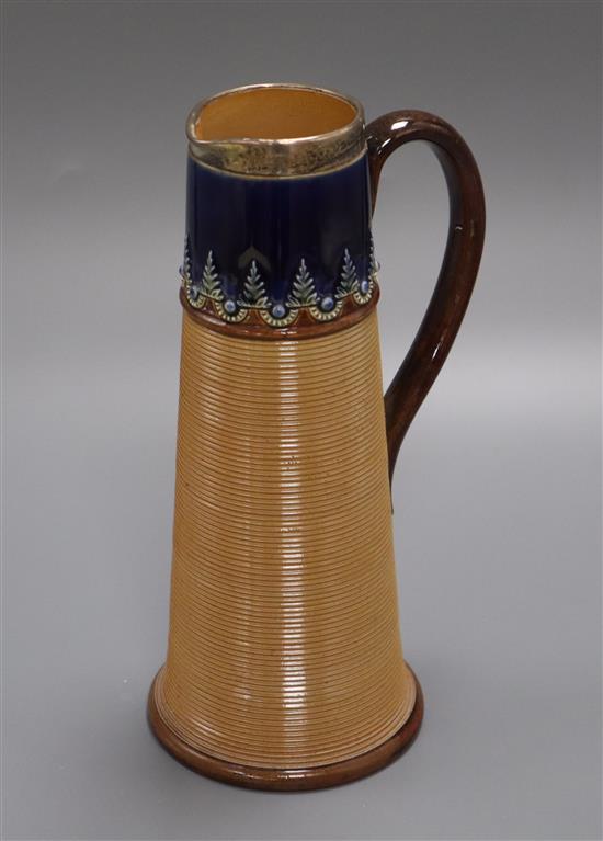 A Doulton Lambeth silver-mounted stoneware jug, of tapered, ribbed conical form, impressed marks and number 8478, initials FJ (?) hei